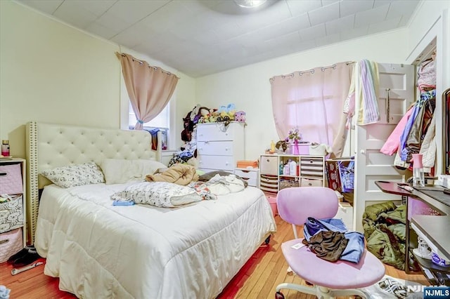 bedroom featuring hardwood / wood-style flooring