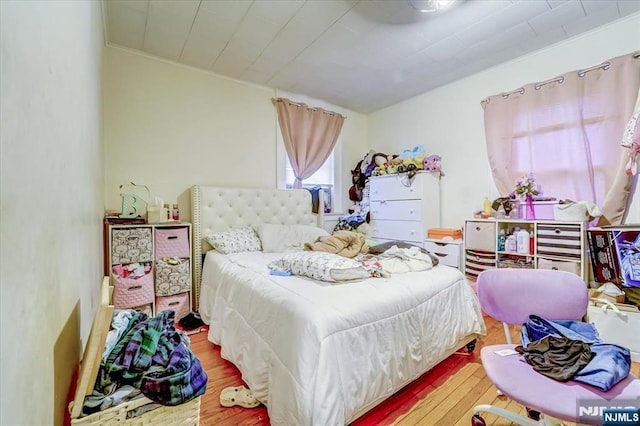 bedroom featuring wood-type flooring