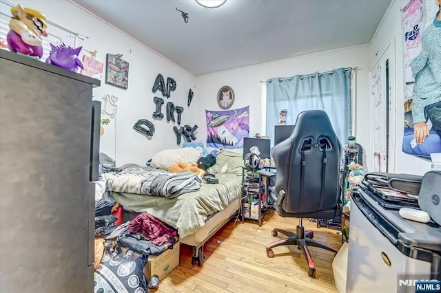 bedroom with light hardwood / wood-style floors