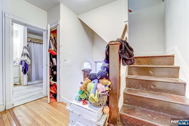 staircase featuring hardwood / wood-style flooring