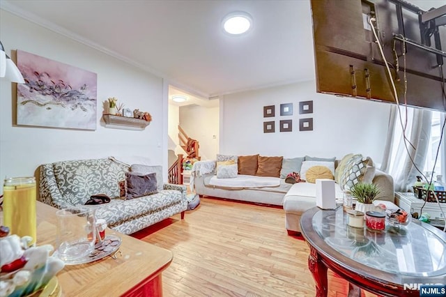 living room featuring ornamental molding and hardwood / wood-style floors