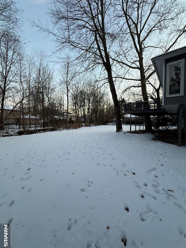 view of yard layered in snow