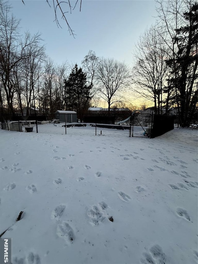 view of yard layered in snow