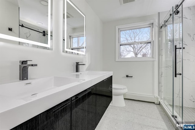 bathroom with vanity, a baseboard heating unit, toilet, and walk in shower