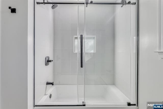 bathroom featuring enclosed tub / shower combo