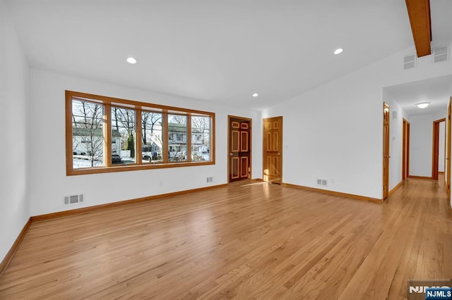 spare room featuring light hardwood / wood-style floors