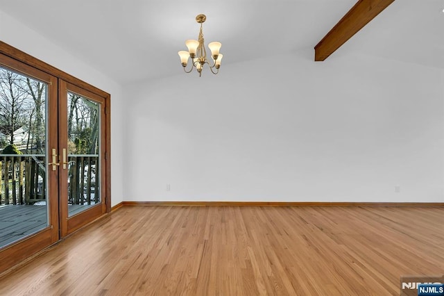 unfurnished room featuring lofted ceiling with beams, french doors, a chandelier, and light wood-type flooring