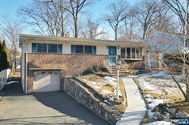 view of front of property featuring a garage