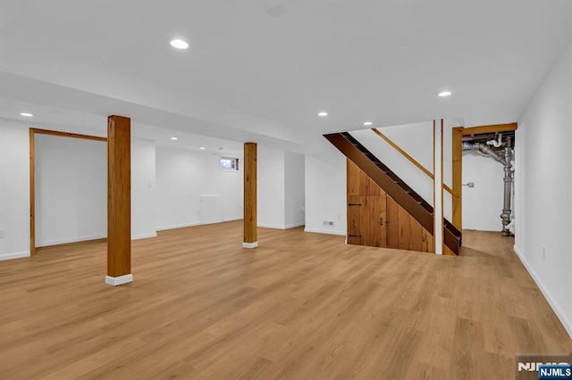 basement featuring light wood-type flooring