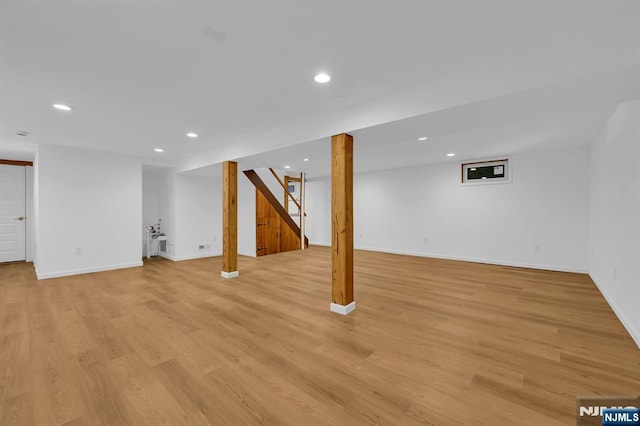 basement featuring light hardwood / wood-style floors