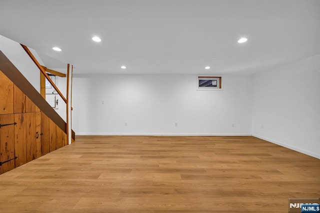 basement featuring light hardwood / wood-style floors