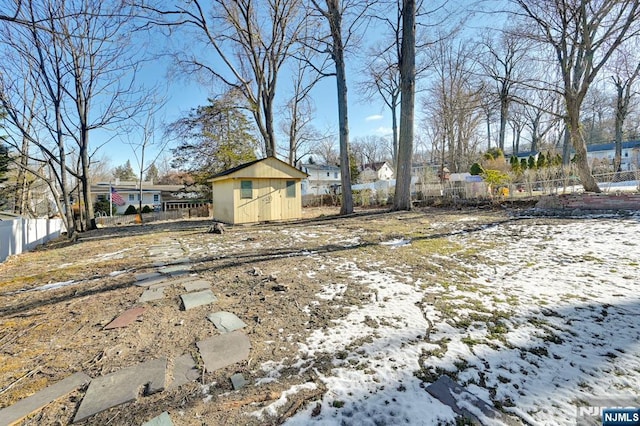 view of yard layered in snow