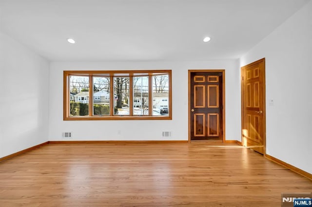 spare room with light wood-type flooring