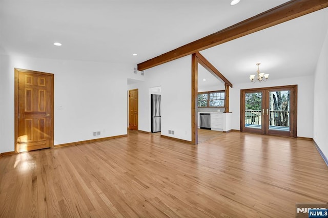 unfurnished living room with a notable chandelier, light hardwood / wood-style floors, french doors, and vaulted ceiling with beams