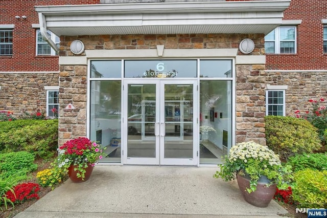 view of exterior entry featuring french doors