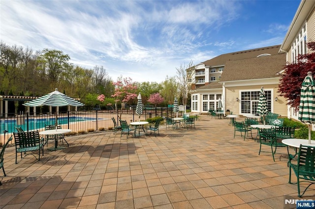 view of patio with a community pool