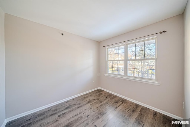 spare room featuring hardwood / wood-style floors