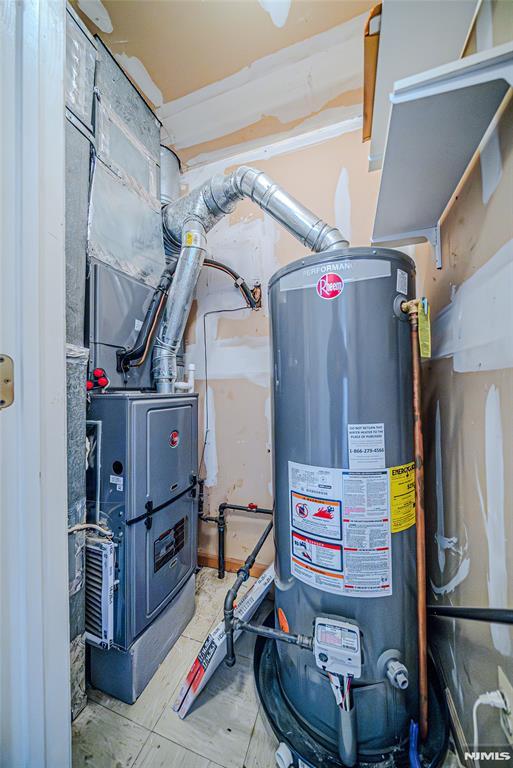 utility room with gas water heater