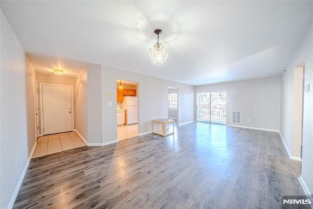 unfurnished living room featuring light hardwood / wood-style floors