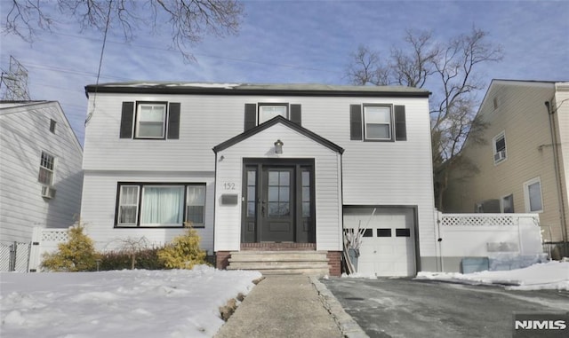 view of front of home with a garage