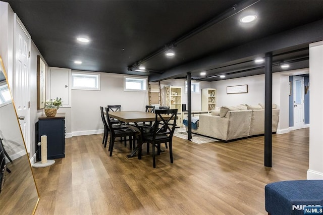 dining area with hardwood / wood-style floors