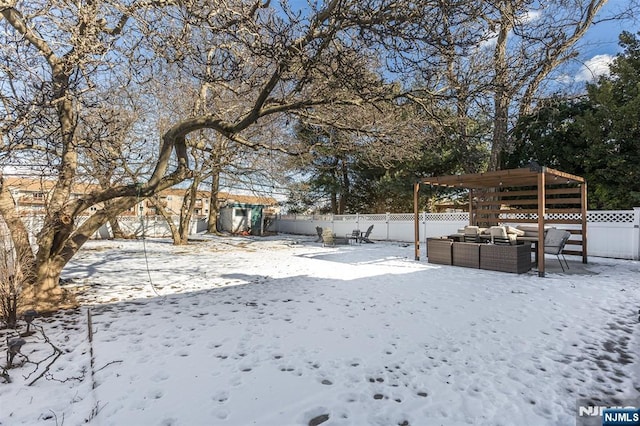 yard covered in snow featuring outdoor lounge area