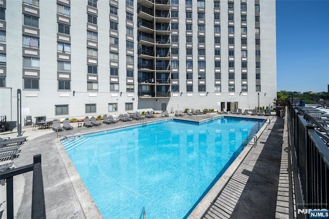 view of swimming pool featuring a patio area