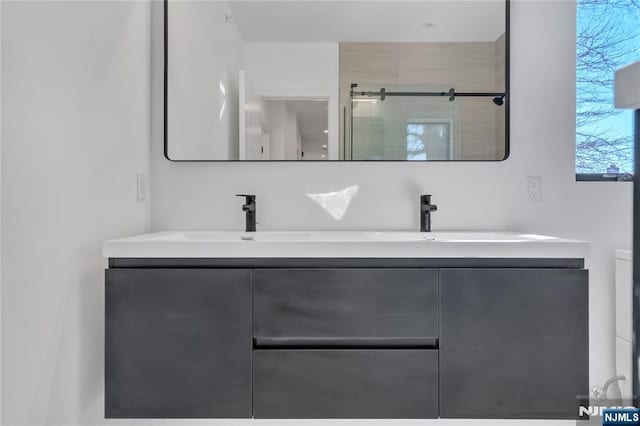 bathroom with vanity and an enclosed shower