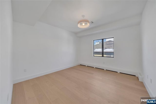 empty room with light wood-type flooring