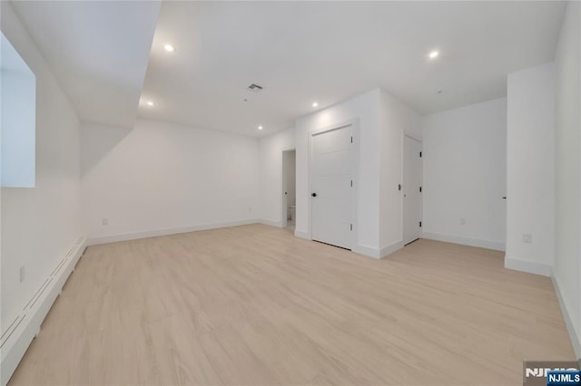 unfurnished room with light hardwood / wood-style flooring