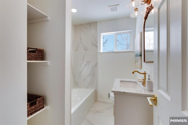 bathroom with vanity and shower / bathing tub combination