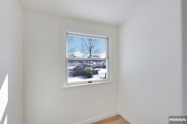 unfurnished room featuring light hardwood / wood-style floors