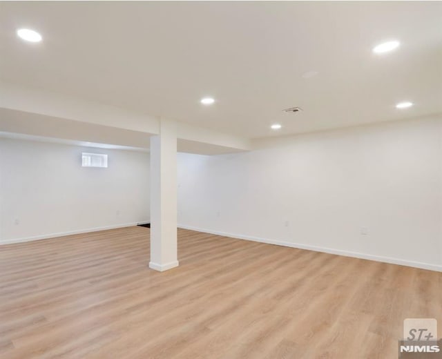 basement featuring light wood-type flooring