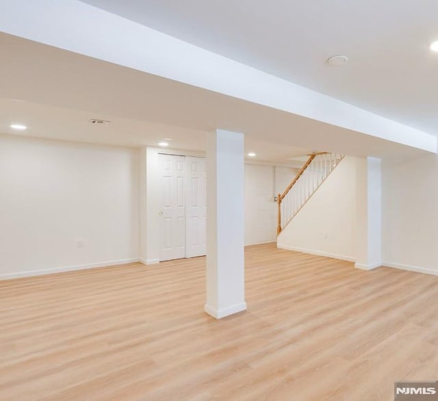 basement featuring light hardwood / wood-style flooring