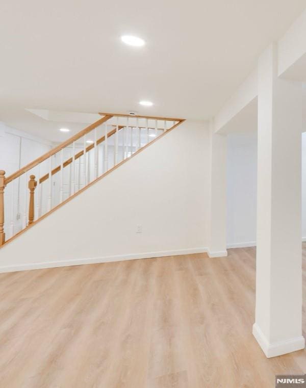 basement featuring light wood-type flooring