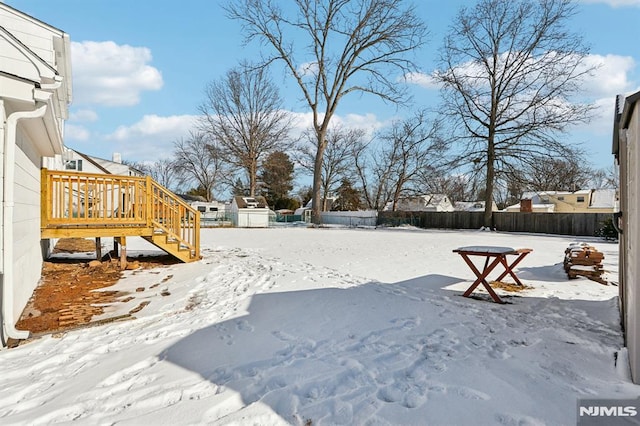 view of yard covered in snow