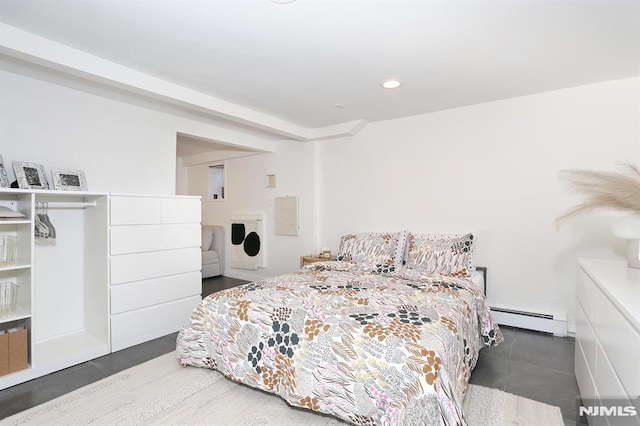 bedroom with a baseboard heating unit