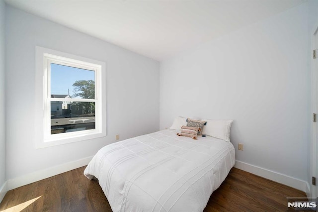 bedroom featuring dark hardwood / wood-style floors