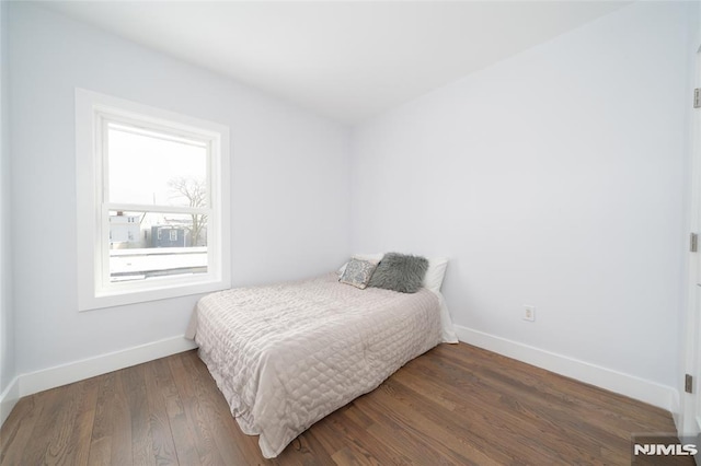 bedroom featuring dark hardwood / wood-style floors