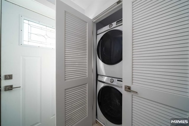 laundry room featuring stacked washer / dryer