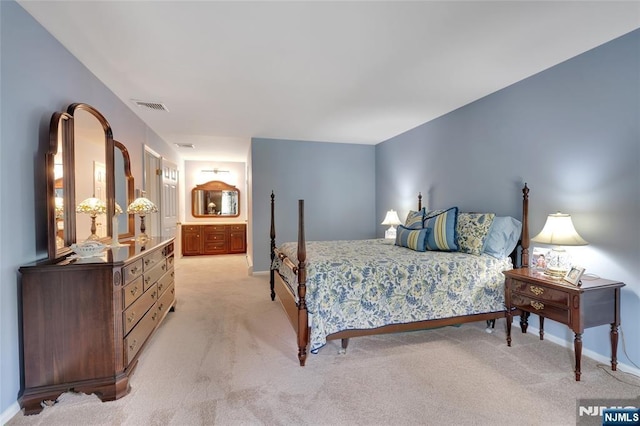 bedroom with visible vents, baseboards, and light colored carpet