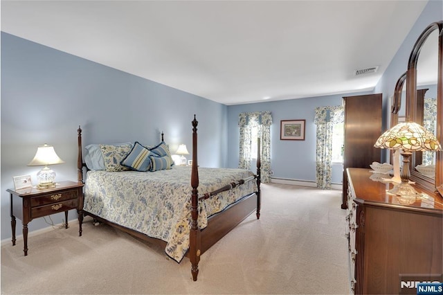 bedroom featuring light carpet, visible vents, and baseboards