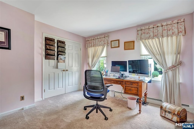 carpeted office space featuring baseboards