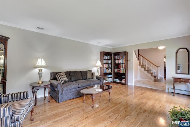 living room featuring baseboards, stairway, light wood-type flooring, ornamental molding, and a baseboard radiator