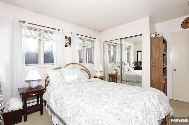 carpeted bedroom featuring a closet