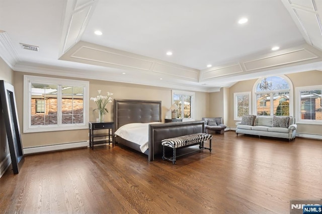 bedroom featuring dark hardwood / wood-style floors, ornamental molding, a raised ceiling, and baseboard heating