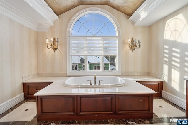 bathroom featuring crown molding, plenty of natural light, and a tub