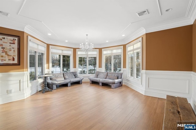 sunroom with an inviting chandelier