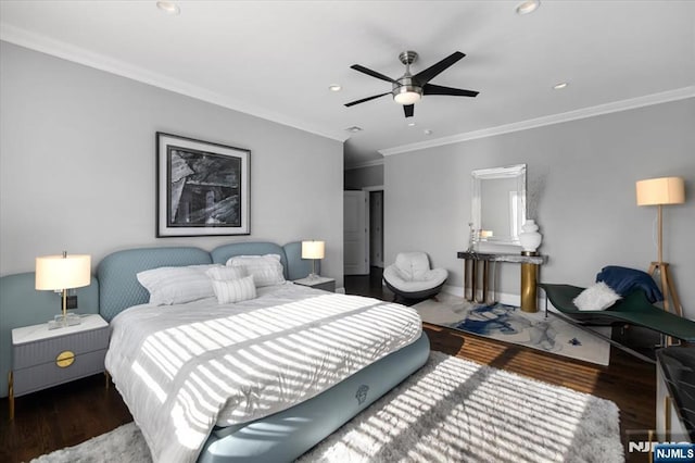 bedroom featuring crown molding, dark hardwood / wood-style flooring, and ceiling fan