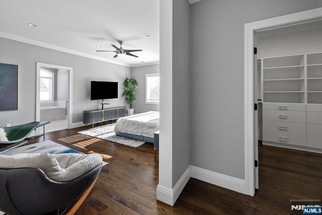 bedroom featuring crown molding, ceiling fan, connected bathroom, and dark wood-type flooring